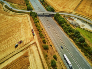 Aerial drone view of beautiful French countryside and six-lane motorway in Brittany, France