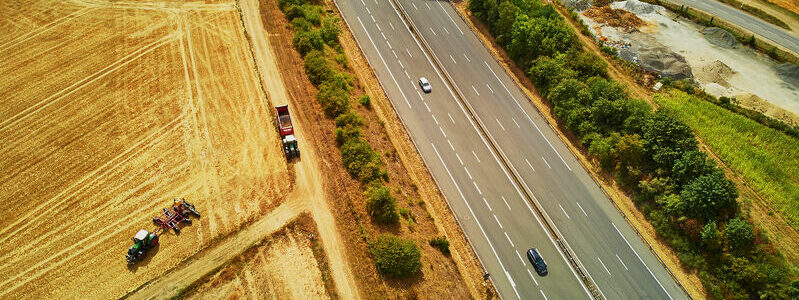 Aerial drone view of beautiful French countryside and six-lane motorway in Brittany, France